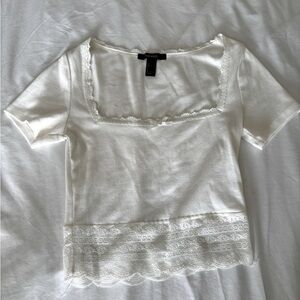 Short sleeve white top with ruffle detail